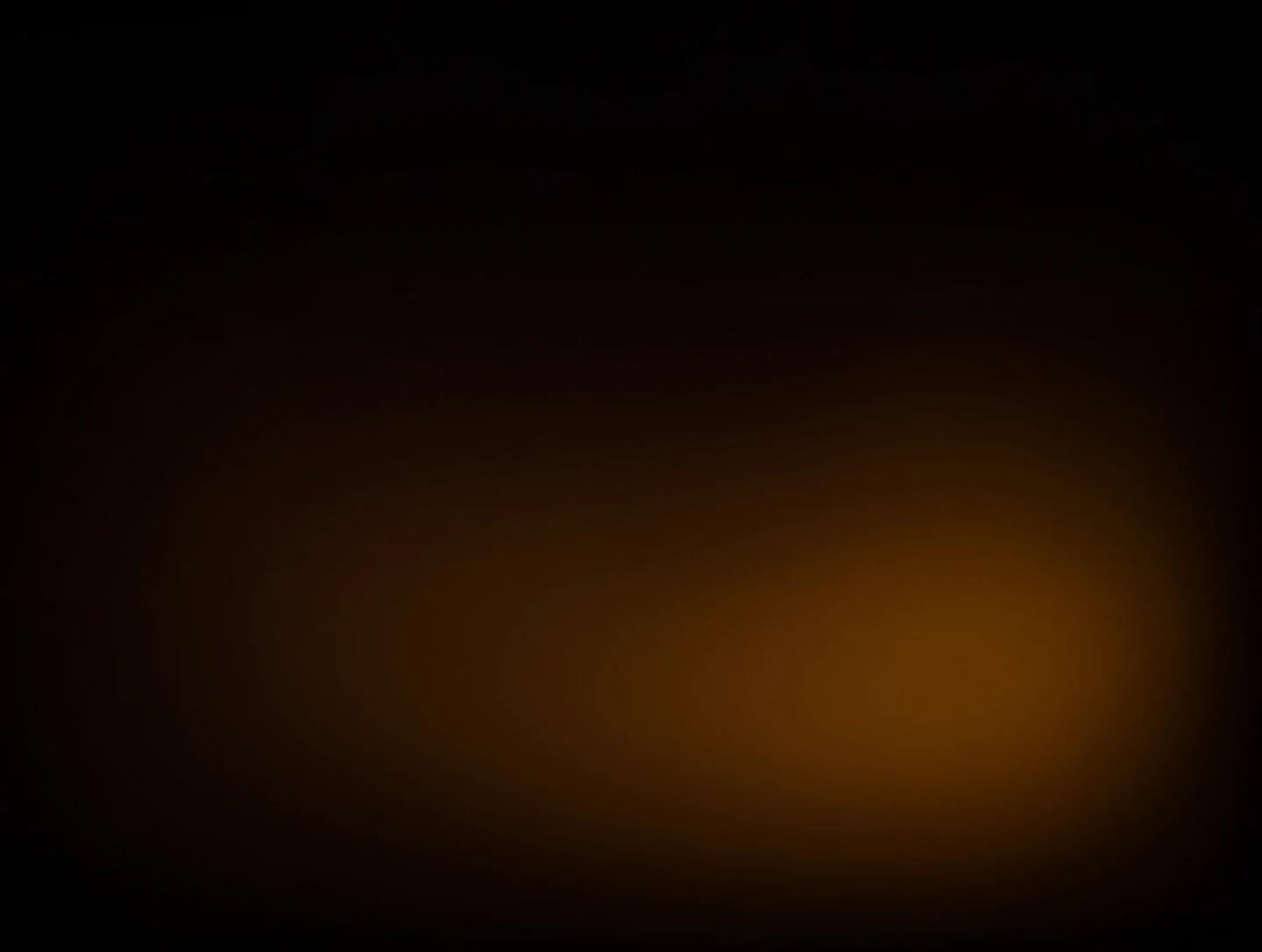 AMOLED & Dark wallpaper fitted to the Galaxy Z Fold 8 main display — wide warm amber glow sinking into blackness on the lower right
