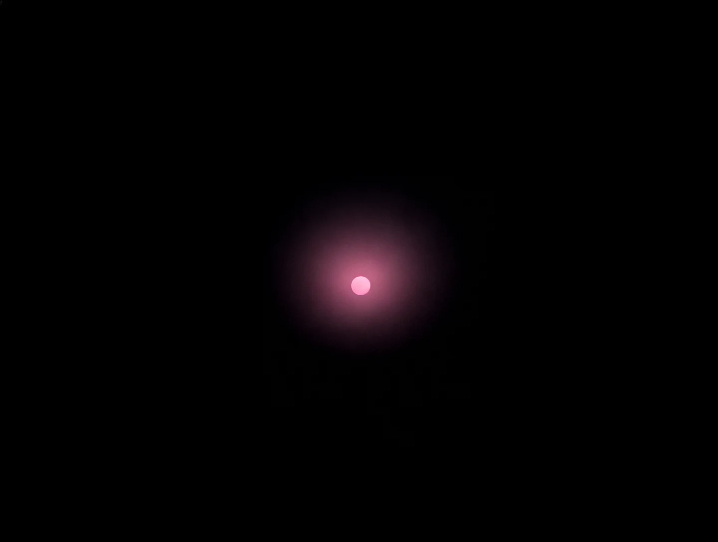 AMOLED & Dark wallpaper fitted to the Galaxy Z Fold 8 main display — a soft rose-pink glimmer sitting at the centre, surrounded by black