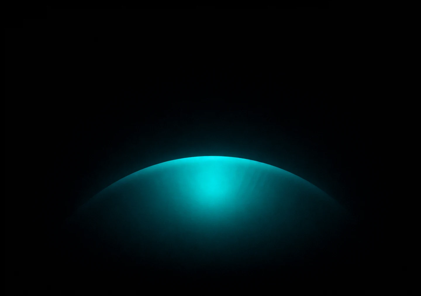 AMOLED & Dark wallpaper fitted to the iPhone Duo inner display — a soft deep-teal elliptical halo centred low on pure black