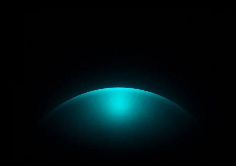 AMOLED & Dark wallpaper fitted to the iPhone Duo inner display — a soft deep-teal elliptical halo centred low on pure black
