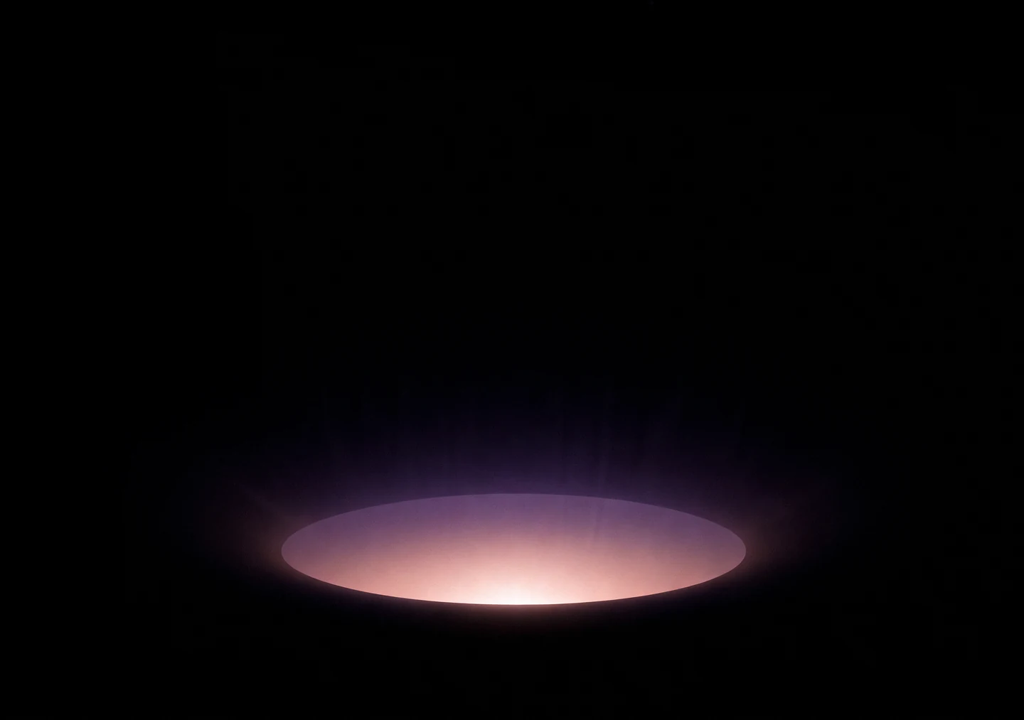 AMOLED & Dark wallpaper fitted to the iPhone Duo inner display — a single soft mauve halo glowing low on pure black, enclosed by deep black
