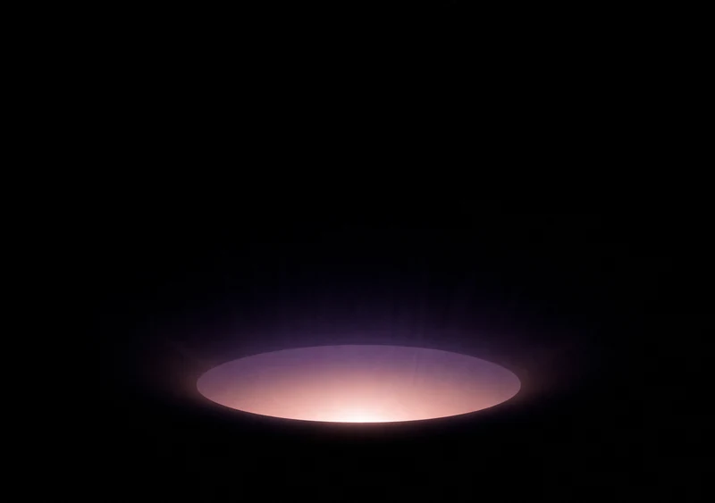 AMOLED & Dark wallpaper fitted to the iPhone Duo inner display — a single soft mauve halo glowing low on pure black, enclosed by deep black