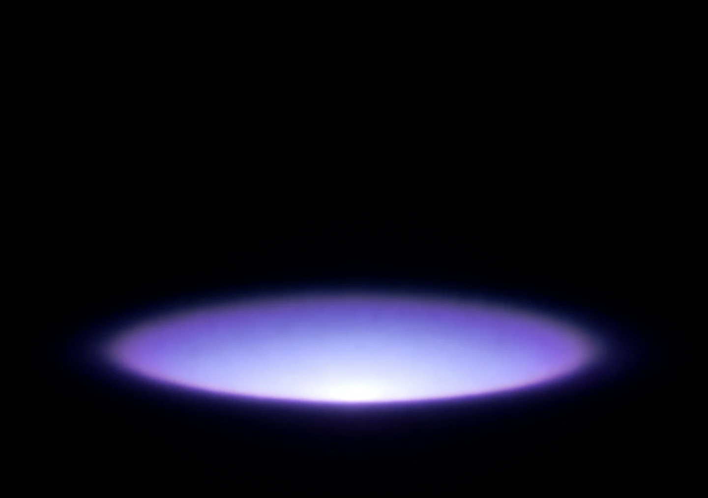 AMOLED & Dark wallpaper fitted to the iPhone Duo inner display — a single violet bloom of light centred low on pure black, fading before every edge