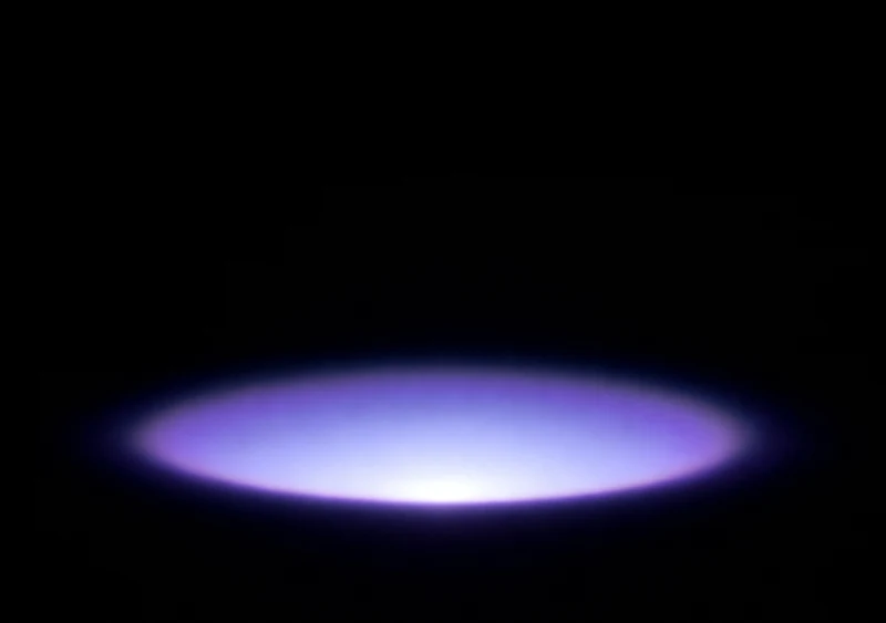 AMOLED & Dark wallpaper fitted to the iPhone Duo inner display — a single violet bloom of light centred low on pure black, fading before every edge
